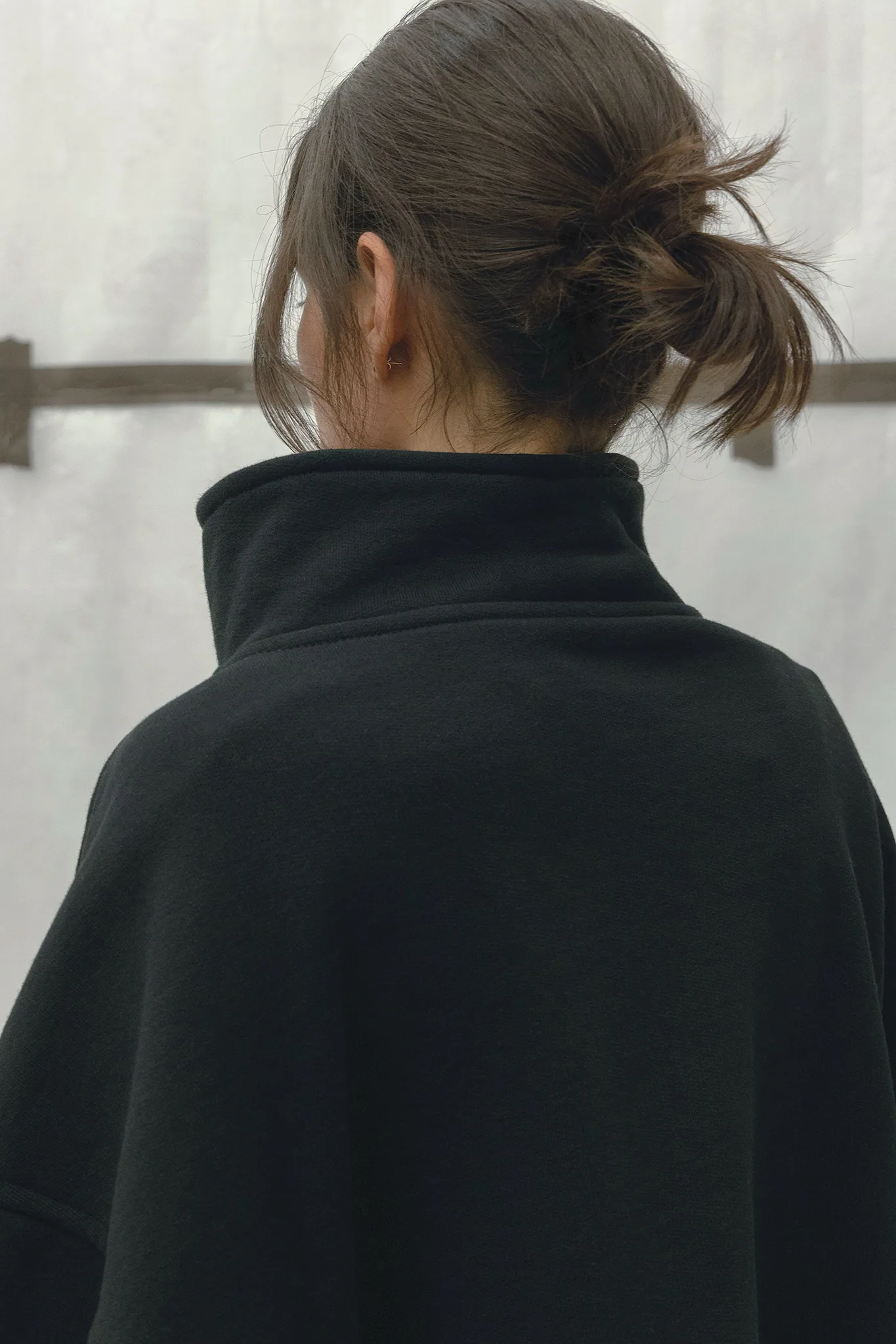 FW25 - Polaire Sweater. Model wears a size 1 in Color Black.